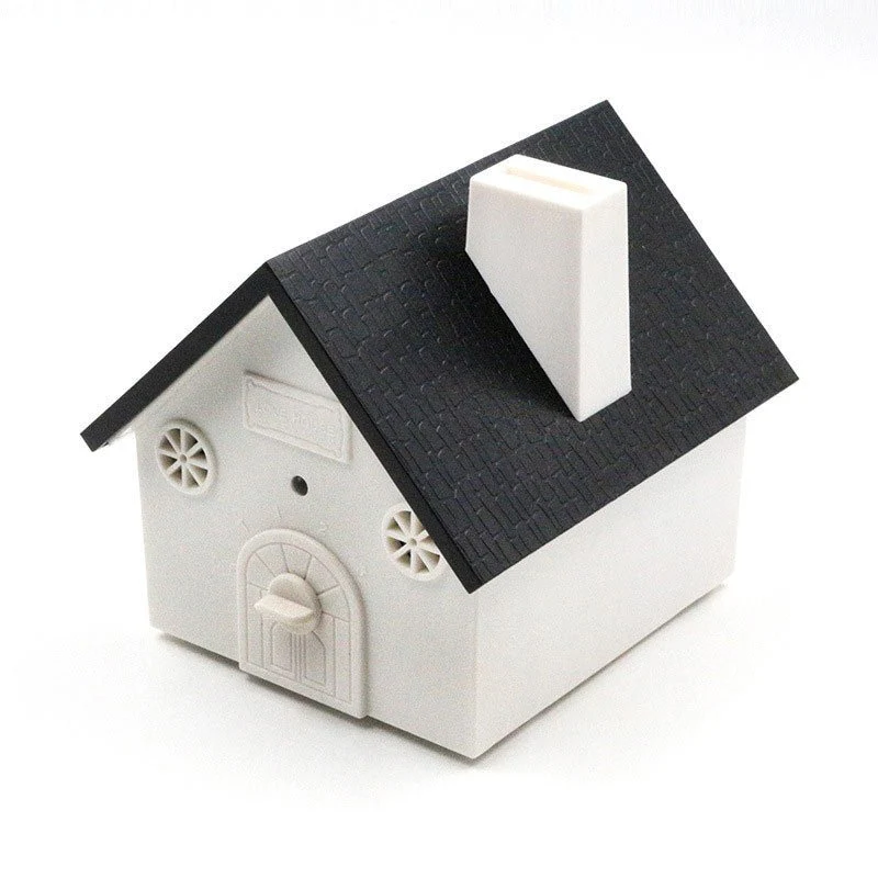 Ultrasonic Dog Repellent — House-Shaped Black and White Device