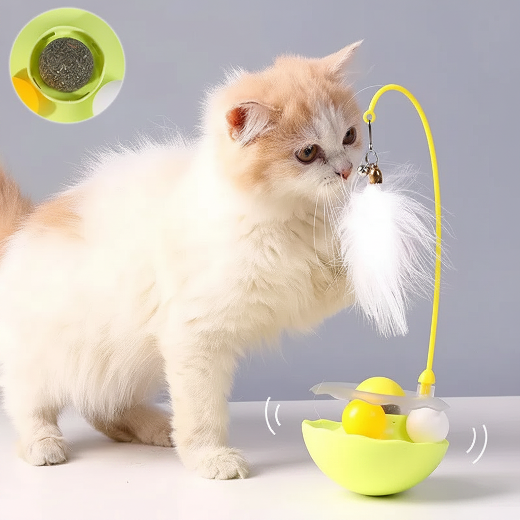 White and orange cat playing with yellow tumbler feather wand toy