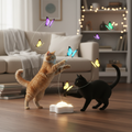 Two cats playing with electric butterfly toy in cozy home