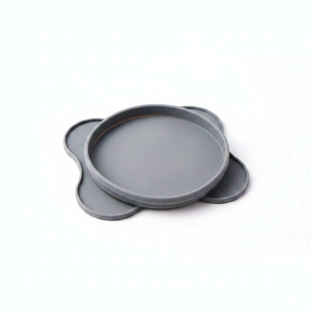 Grey silicone pet bowl folded flat showing foldable travel-friendly design